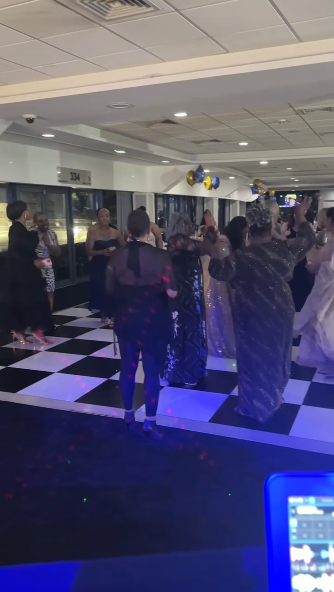 Packed dance floor at a wedding reception